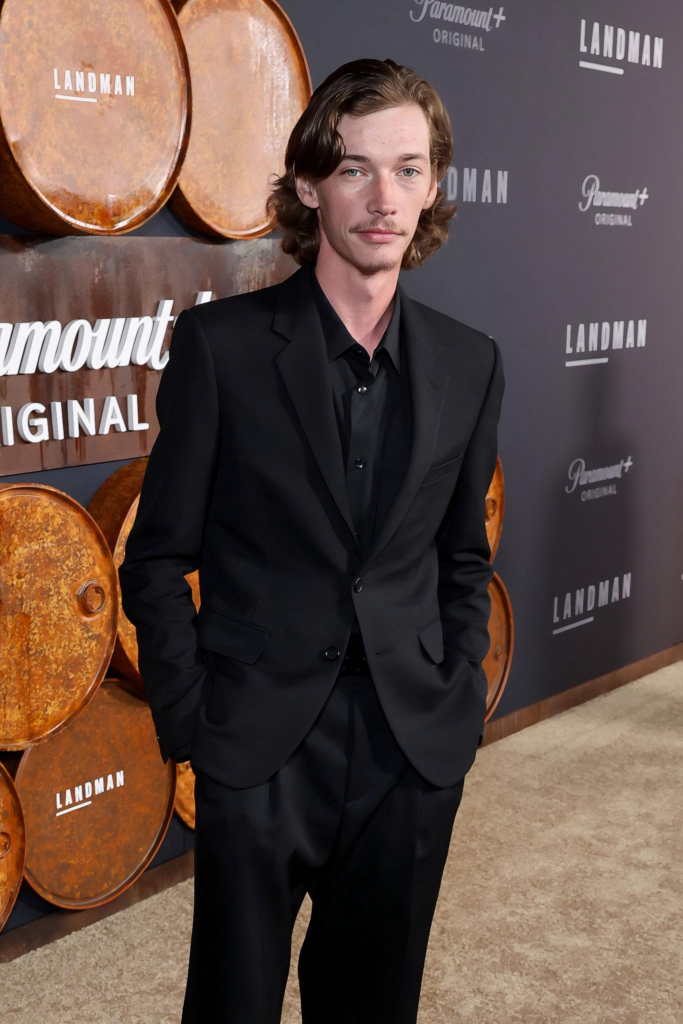 Jacob Lofland, attending the Landman premiere in Los Angeles, is wearing a classic black suit with a matching black shirt