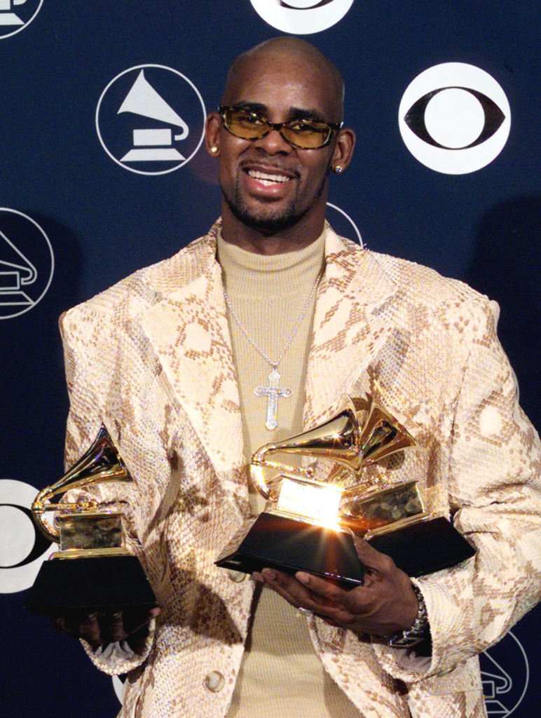 R. Kelly poses with his three Grammys in this 1998 photograph