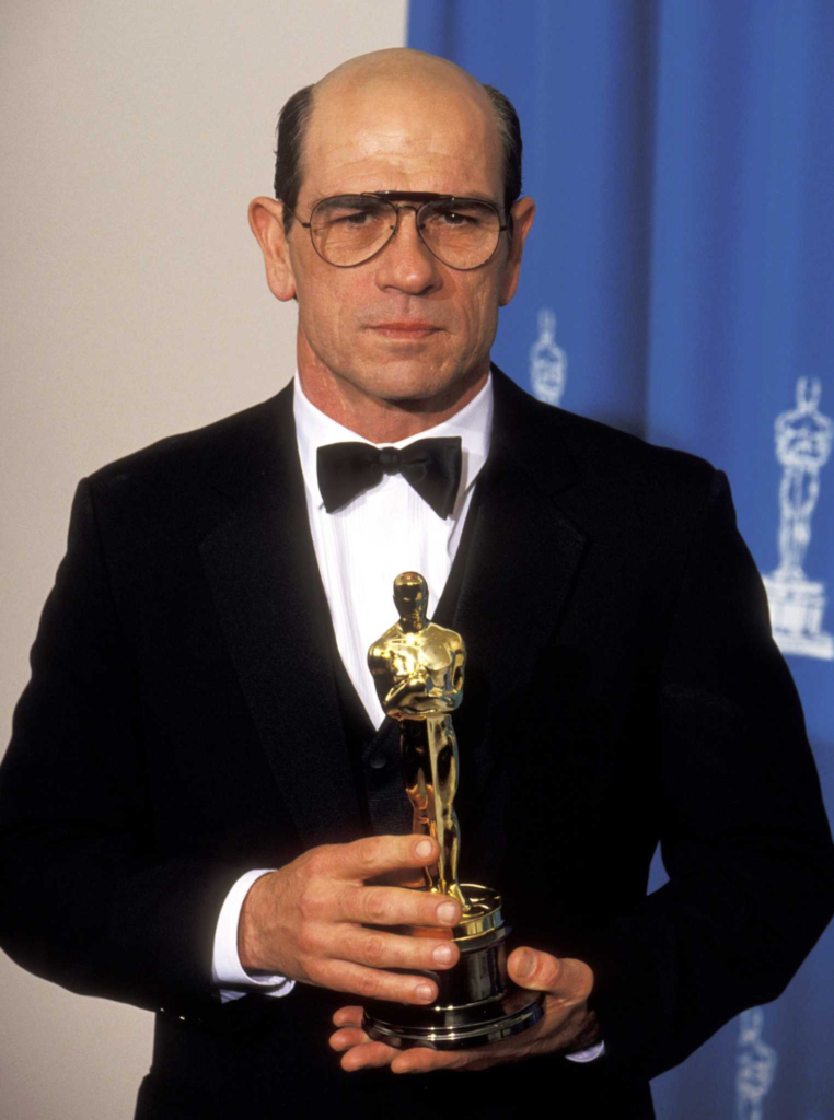 actor Tommy Lee Jones holding the Oscar for Best Supporting Actor at the 66th Academy Awards in 1994