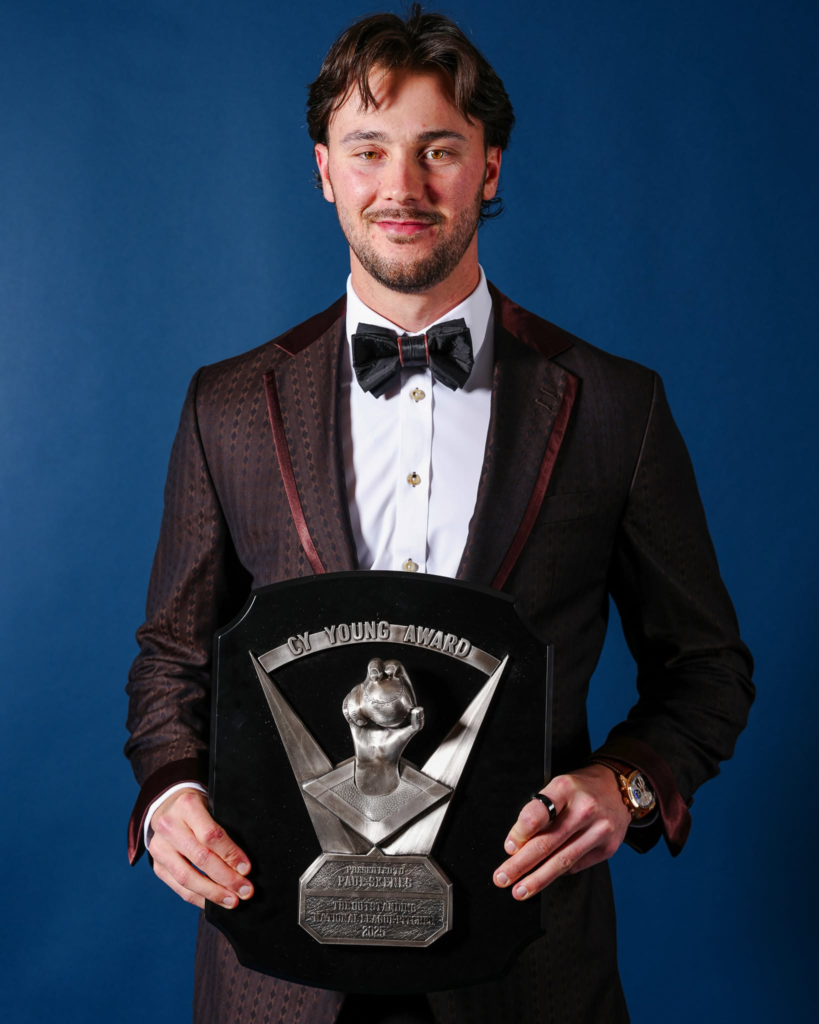 Paul Skenes holding his 2025 National League Cy Young Award at the BBWAA Awards Dinner