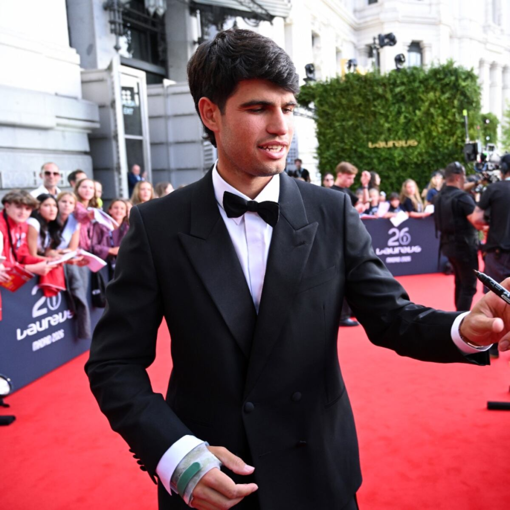 Carlos Alcaraz is pictured arriving in a tailored black suit and bow tie at the 2026 Laureus World Sports Awards in Madrid