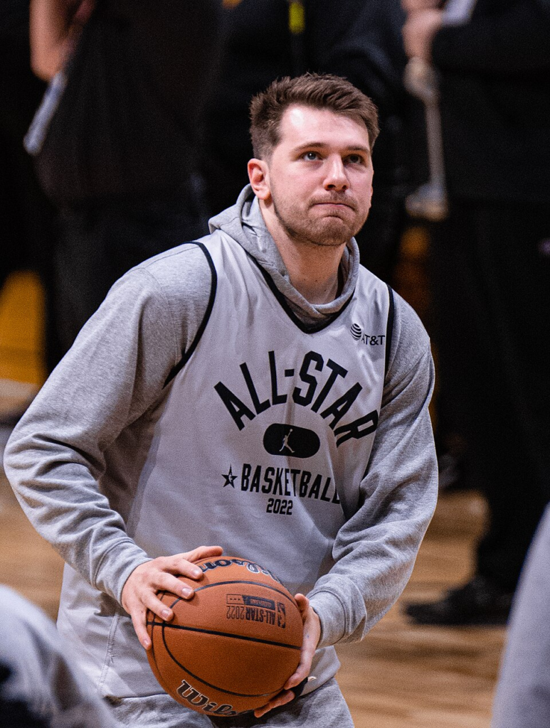 Luka Dončić holding a basketball