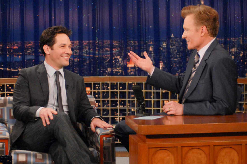 Conan O'Brien hosting his talk show with Paul Rudd as a guest