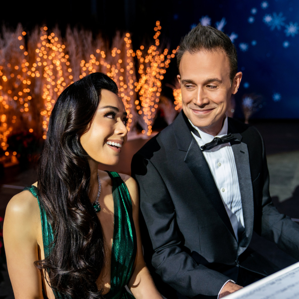 Aimee Garcia and Freddie Prinze Jr. in a scene from the 2022 Netflix film "Christmas with You"