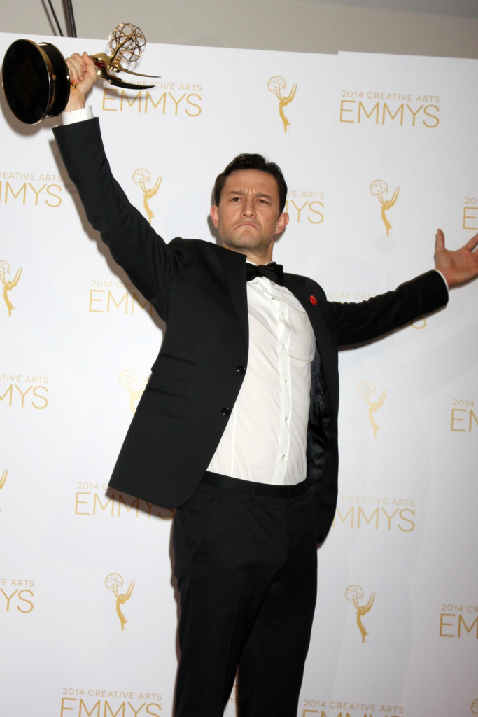 Joseph Gordon-Levitt holding his first Emmy award for HitRecord on TV at the 2014 Creative Arts Emmy Awards