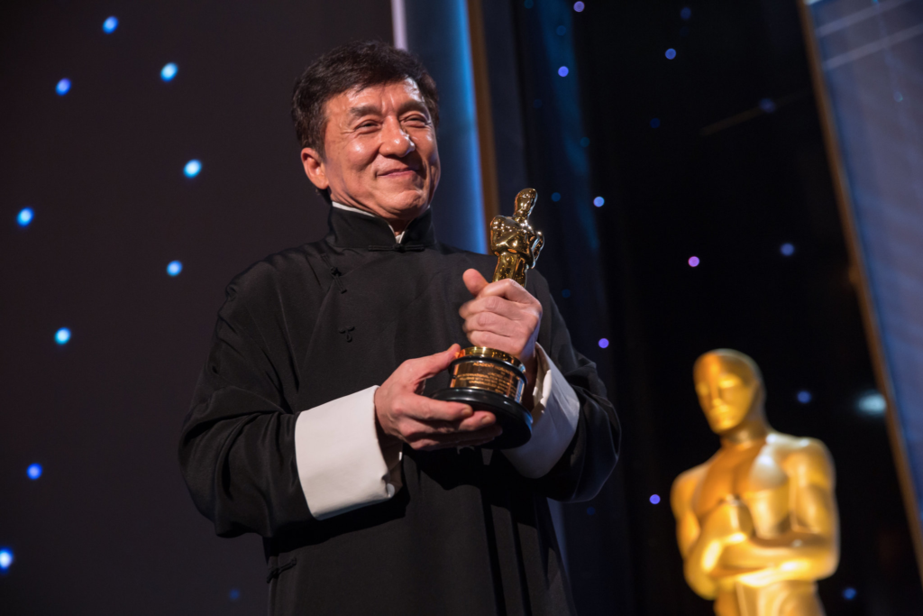 Jackie Chan holds his Honorary Oscar award, acknowledging his lifetime achievements in cinema at the 2016 Governors Awards