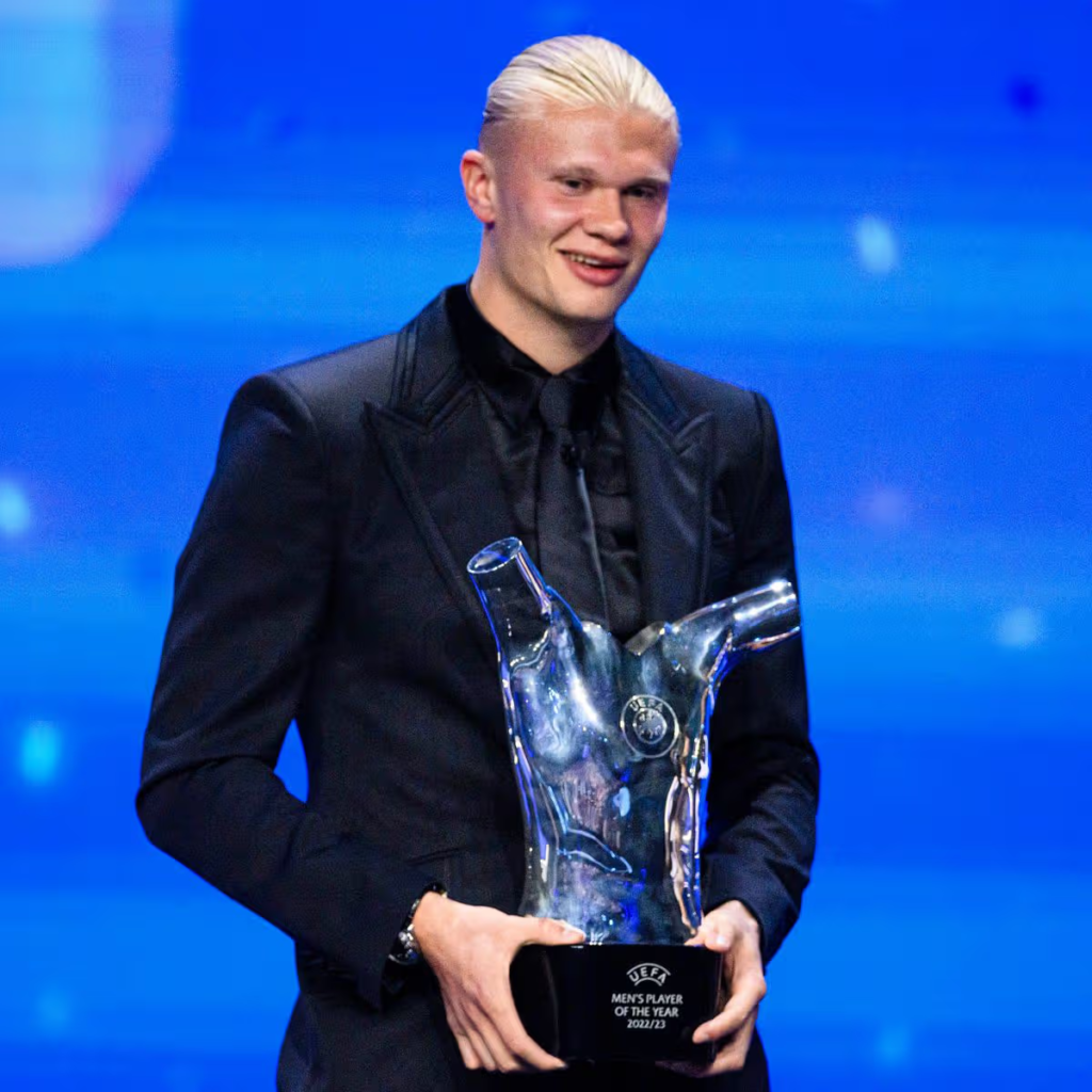 Erling Haaland holding the UEFA Men's Player of the Year award for 2022-2023