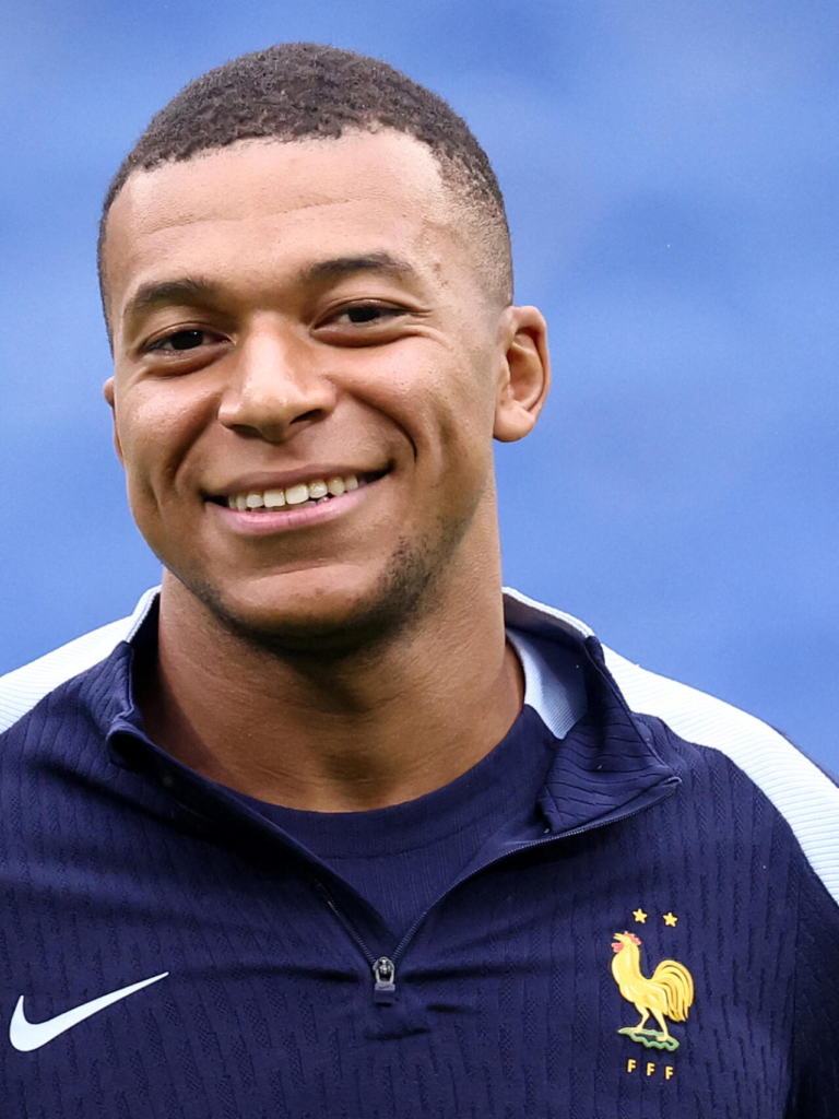 Kylian Mbappé smiling