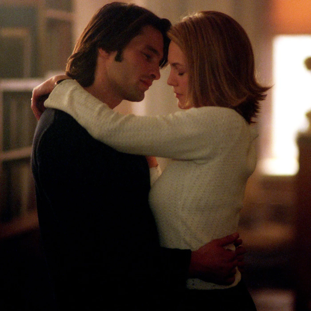 a still from the 2002 erotic thriller film Unfaithful, featuring actors Diane Lane and Olivier Martinez