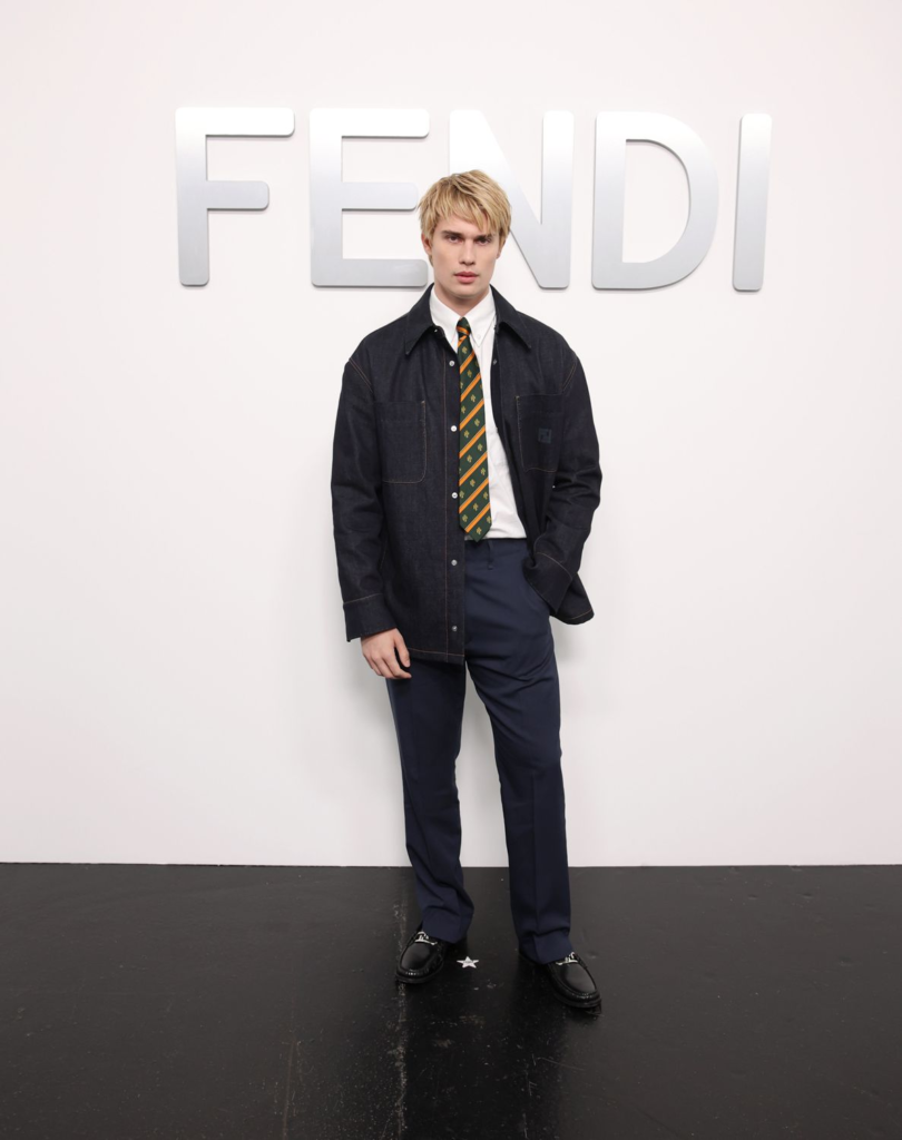 Nicholas Galitzine wears a Fendi dark denim jacket at the brand's Spring/Summer 2025 show in Milan