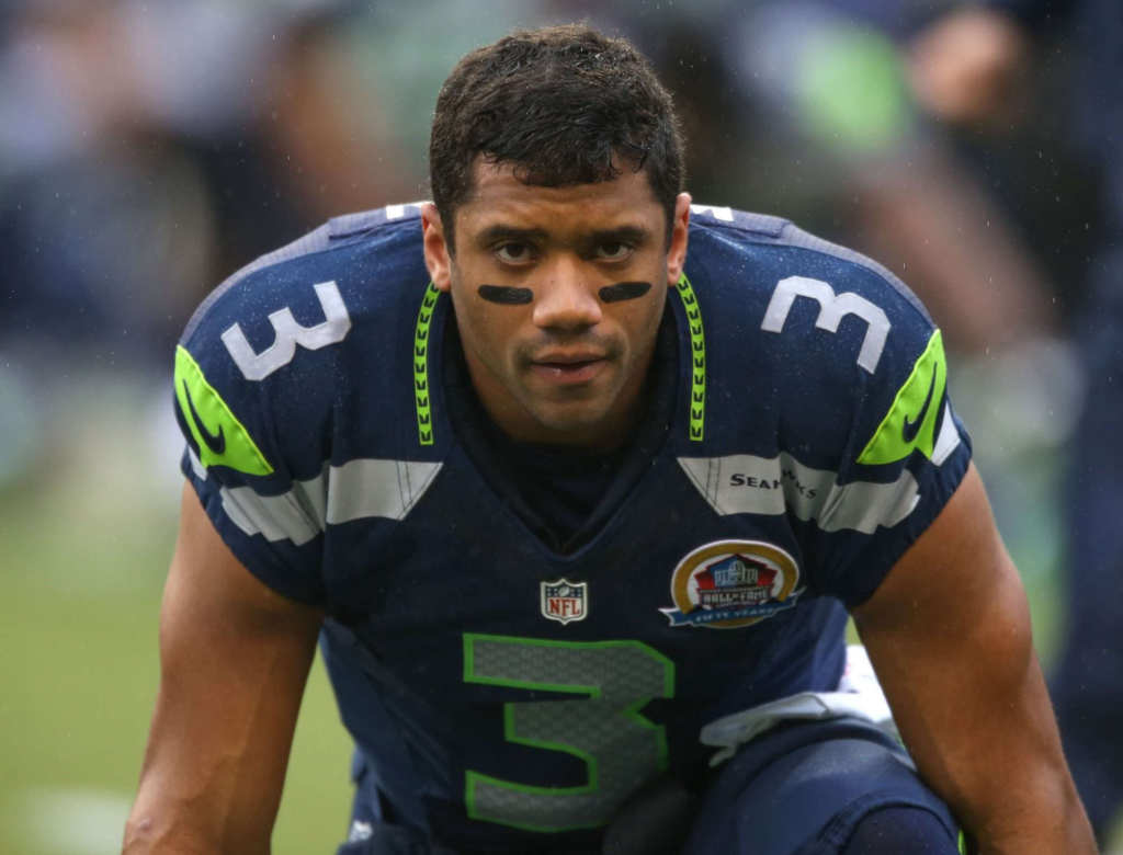 Russell Wilson in a Seattle Seahawks jersey, identifying him as the team's quarterback