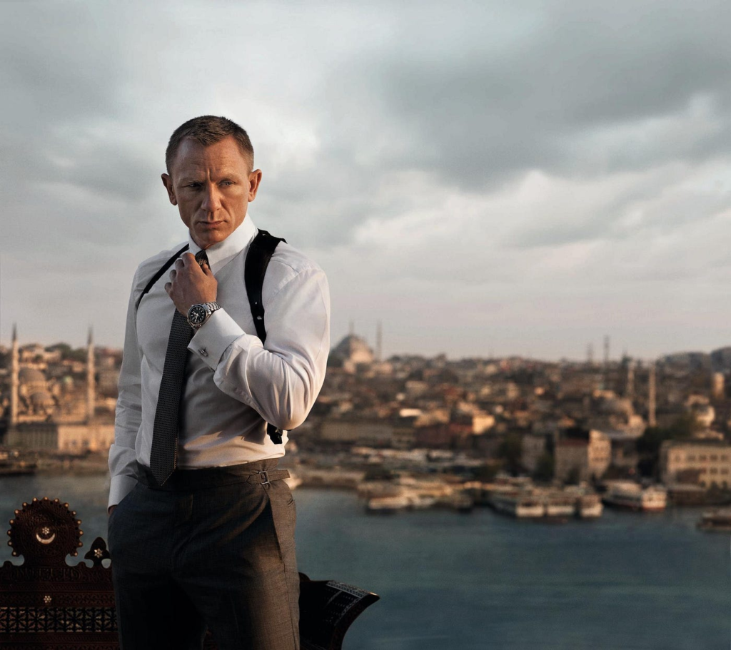 Daniel Craig as secret agent James Bond wearing a crisp white dress shirt, tie, and shoulder holster during a scene filmed in Istanbul, Turkey for the 2012 film Skyfall