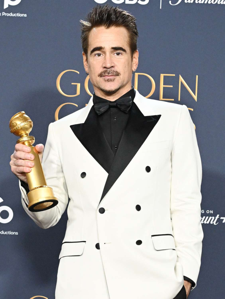 Colin Farrell is pictured holding a Golden Globe award, which he won in January 2025 for his role in The Penguin
