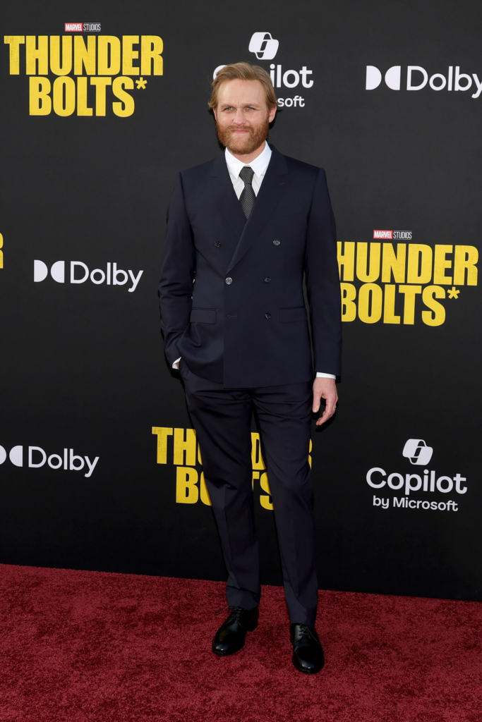 Wyatt Russell is wearing a dark navy Dolce & Gabbana double-breasted suit at the Thunderbolts premiere