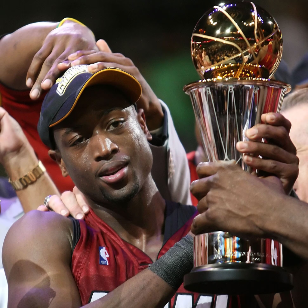 basketball Hall of Famer Dwyane Wade celebrating his first NBA Championship and Finals MVP award in 2006