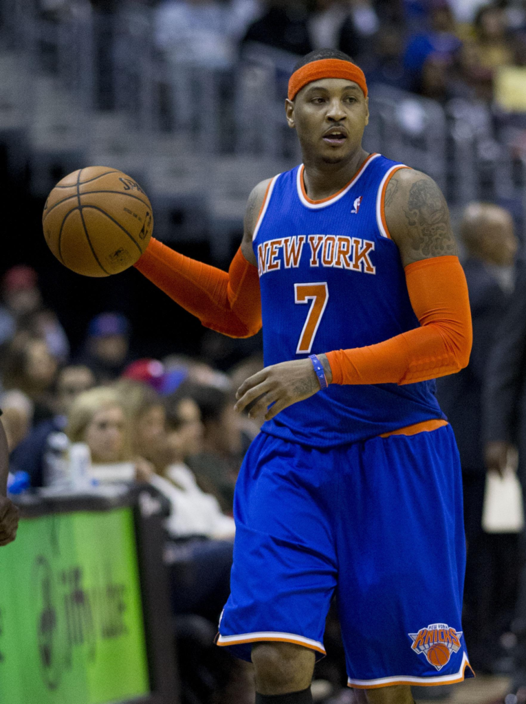 Carmelo Anthony wearing a blue New York Knicks jersey, featured prominently in a 2013 photograph