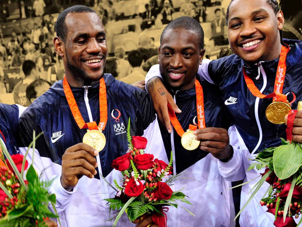 basketball players LeBron James, Dwyane Wade, and Carmelo Anthony celebrating a gold medal win together