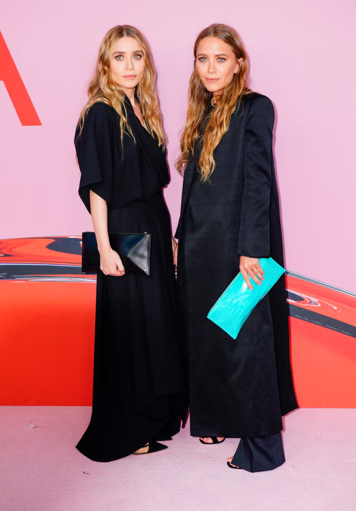 Mary-Kate and Ashley Olsen attending the 2019 CFDA Fashion Awards wearing ensembles from their own brand, The Row