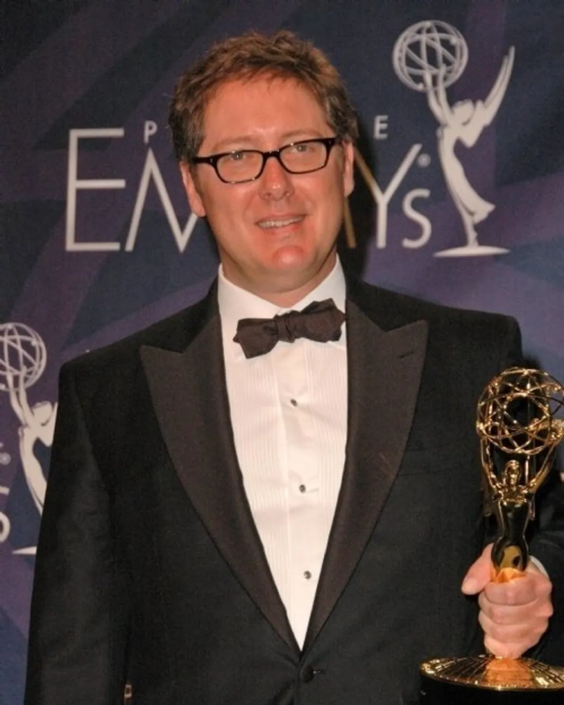 American actor James Spader posing in the press room holding an Emmy Award