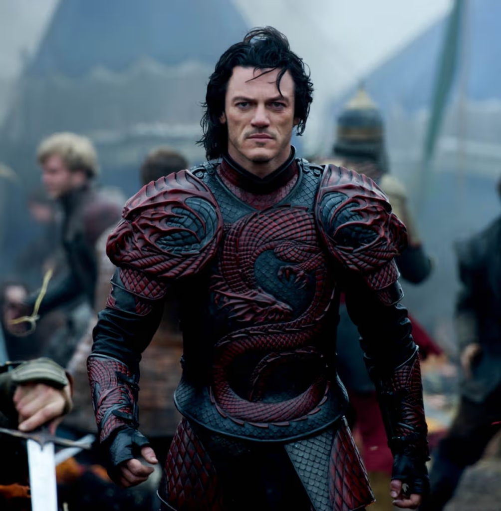 Luke Evans wearing the iconic red-and-black dragon armor as Vlad III / Dracula in the dark fantasy action film Dracula Untold (2014)