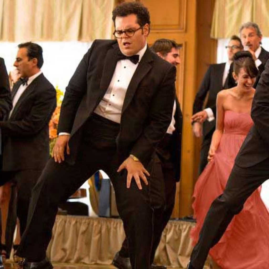 Josh Gad dressed in a tuxedo and glasses as Doug Harris in the 2015 comedy film The Wedding Ringer