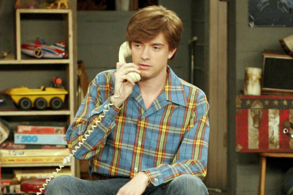 Topher Grace portraying Eric Forman on the hit Fox retro sitcom That '70s Show, which ran for eight seasons from 1998 to 2006