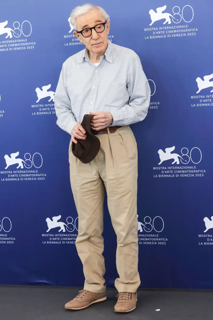 filmmaker Woody Allen in a light blue button-down shirt and khaki trousers at the 80th Venice International Film Festival in September 2023