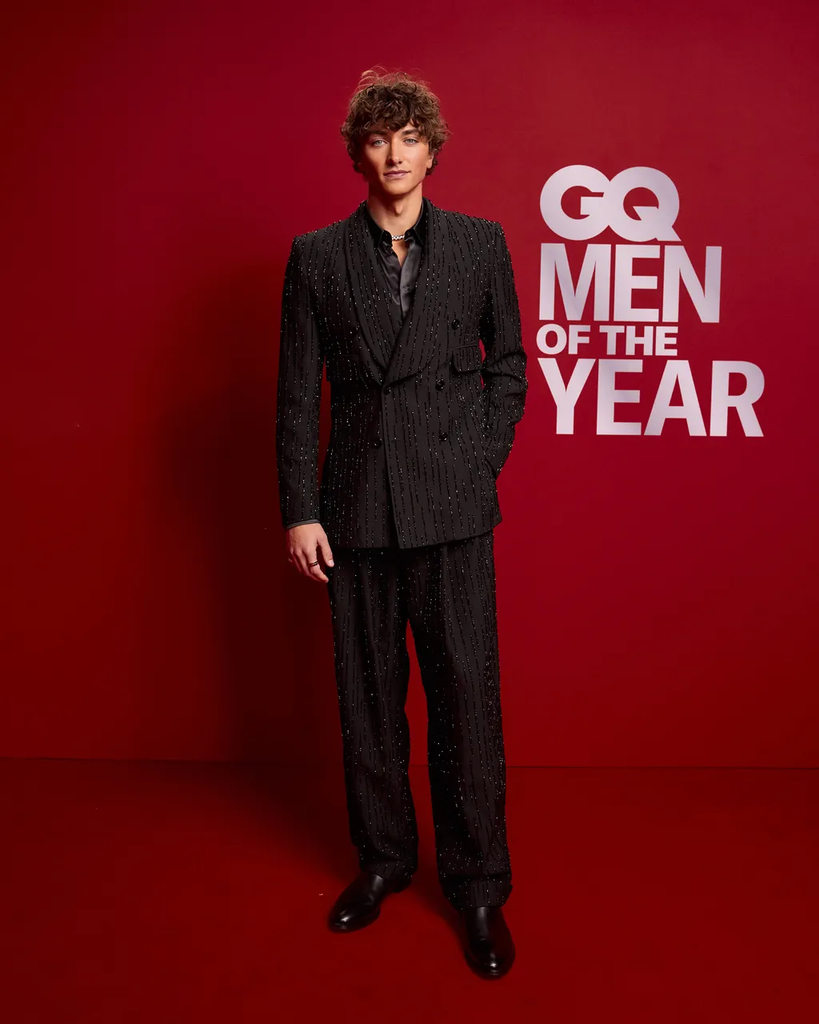 actor Gavin Casalegno attending the British GQ Men of the Year event in London, wearing an embellished black Dolce & Gabbana suit