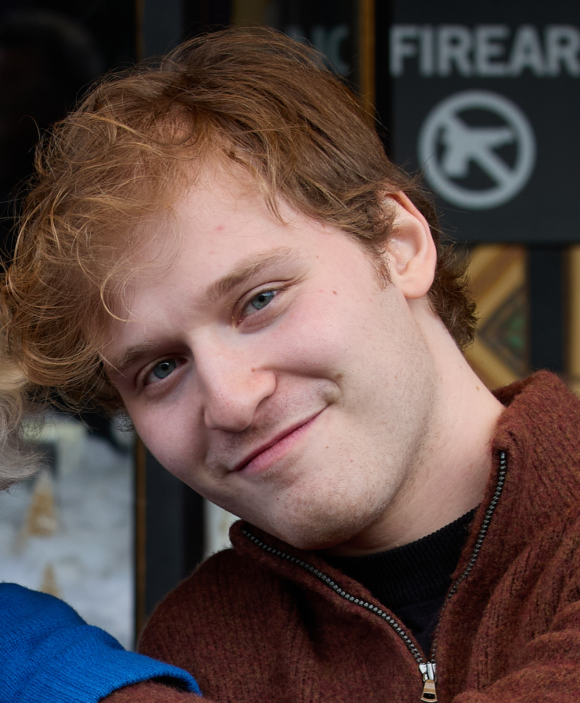 Fred Hechinger smiling