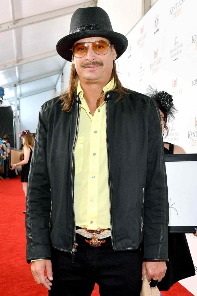 singer Kid Rock wearing a black hat and leather jacket while attending the Kentucky Derby