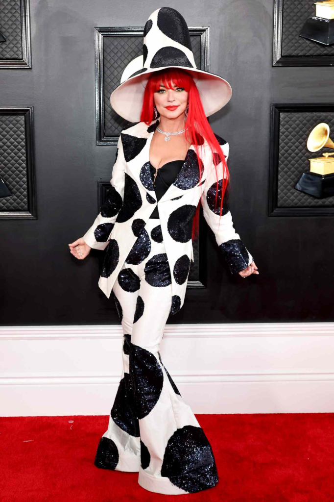 Shania Twain wore a sequined, cow-print inspired suit with dramatic bell-bottom pants and a towering hat designed by Harris Reed to the 2023 Grammy Awards