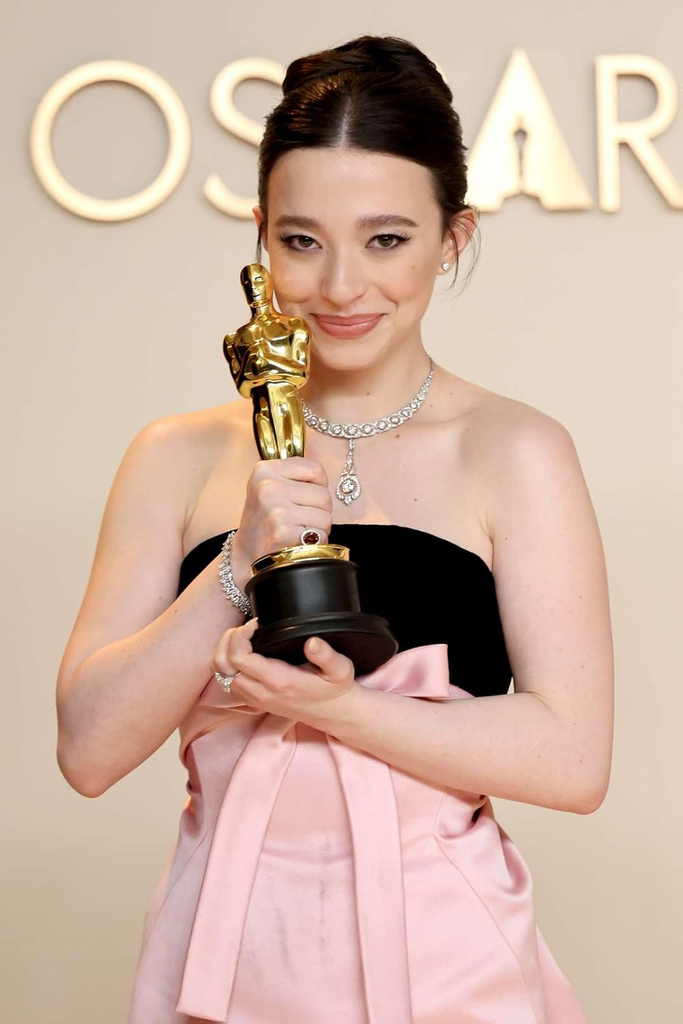 American actress Mikey Madison happily poses with her Best Actress statuette after winning for her leading role in Anora at the 97th Academy Awards