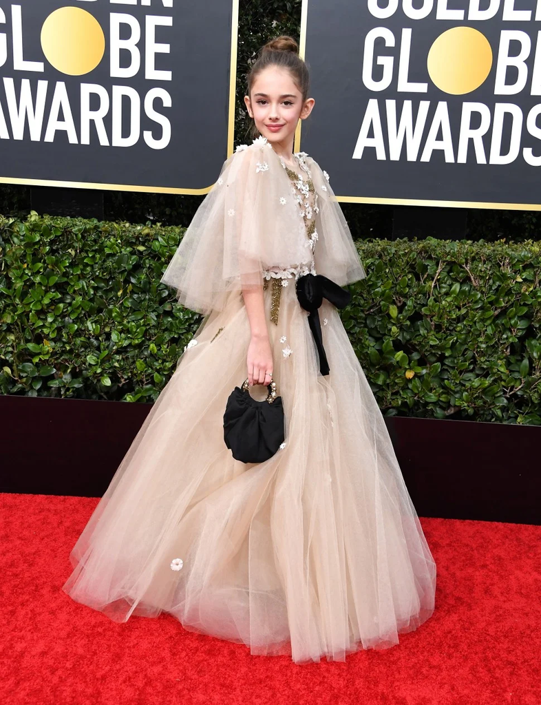 Julia Butters wore a light pink tulle gown by Mischka Aoki with a black handbag at the 77th Annual Golden Globe Awards on January 5, 2020