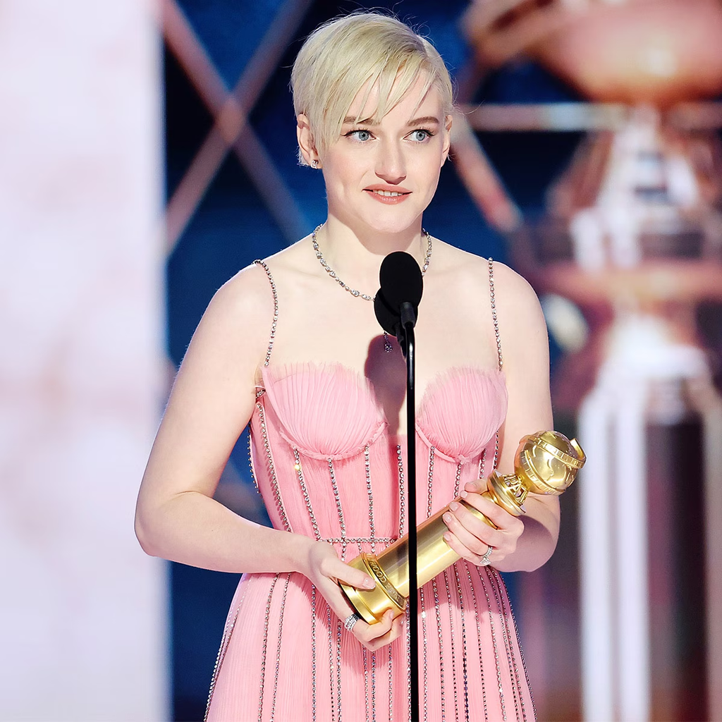 Julia Garner wears a light pink crystal-embroidered Gucci gown while accepting her award at the 80th Annual Golden Globe Awards on January 10, 2023