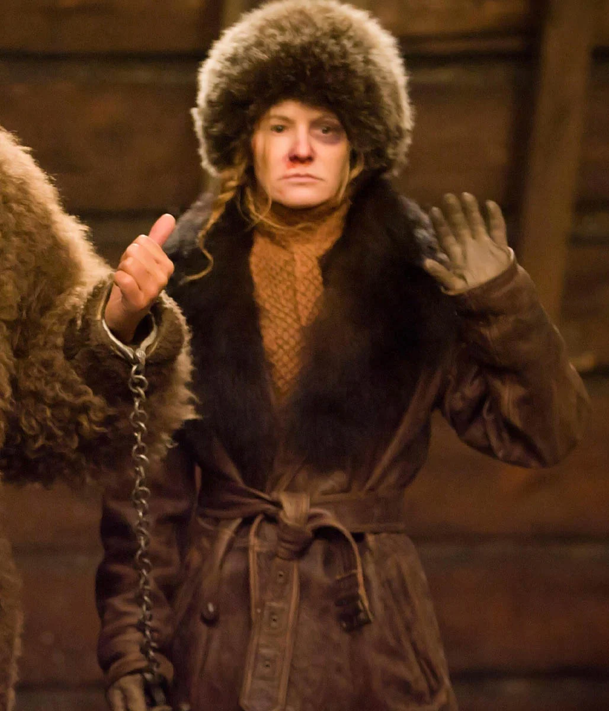 Jennifer Jason Leigh as the captive outlaw Daisy Domergue in the 2015 Quentin Tarantino film The Hateful Eight