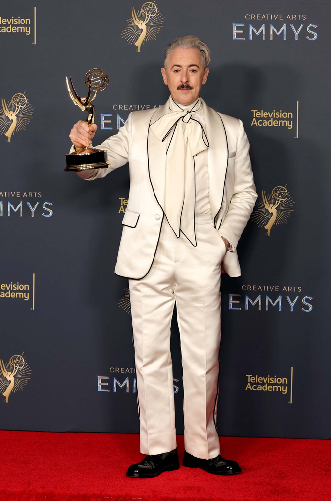 Alan Cumming holding his Emmy Award at the 2025 Creative Arts Emmy Awards