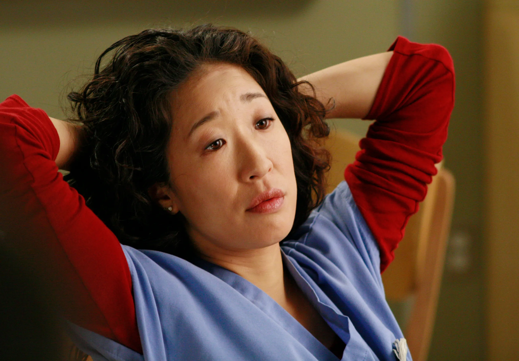 Sandra Oh portraying the character Dr. Cristina Yang in the television series Grey's Anatomy