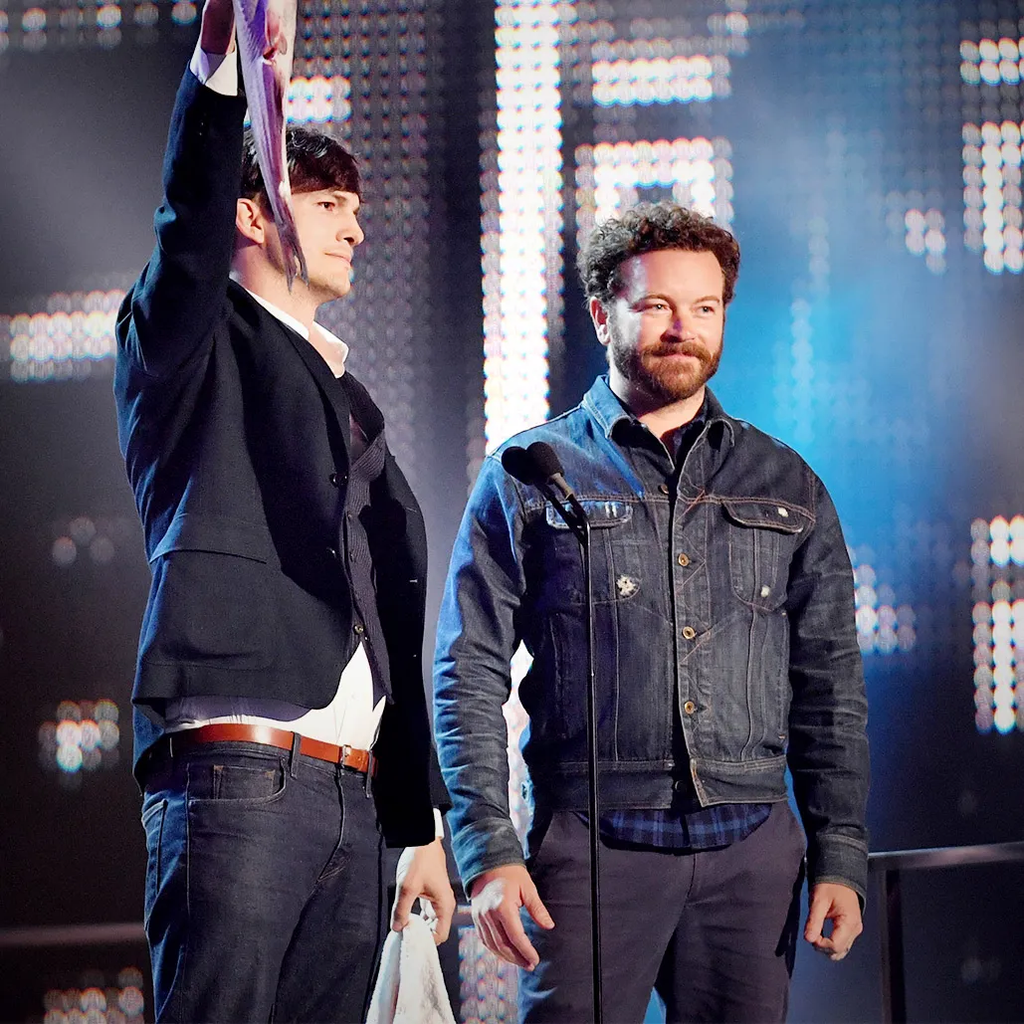 Ashton Kutcher and Danny Masterson on stage presenting an award at the 2017 CMT Music Awards in Nashville, Tennessee