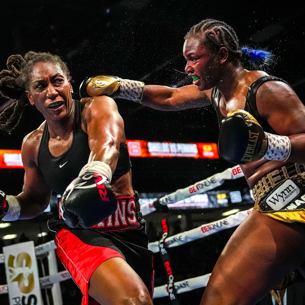 Claressa Shields (right) landing a punch against Danielle Perkins (left) during their undisputed heavyweight championship bout in Flint, Michigan on February 2, 2025