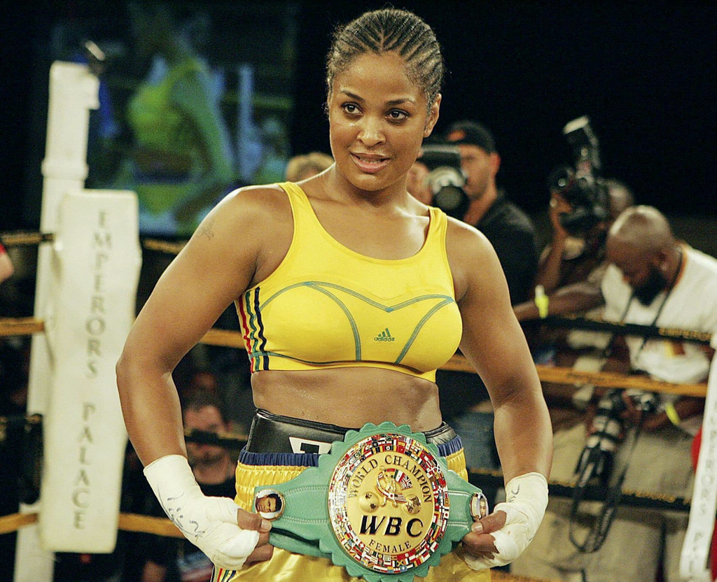 Laila Ali posing with a championship belt