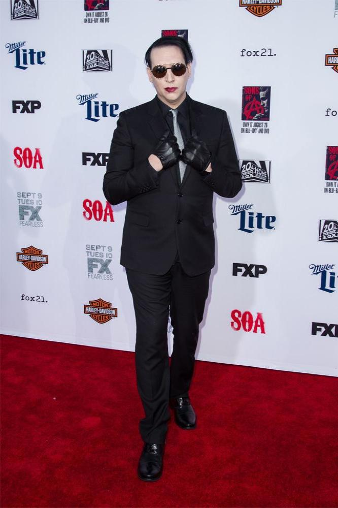 American musician Marilyn Manson posing on a red carpet at the Sons of Anarchy Season 7 Premiere in September 2014
