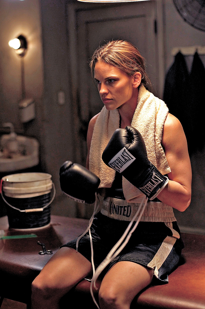 The image shows actress Hilary Swank portraying the character Maggie Fitzgerald in the 2004 drama film Million Dollar Baby