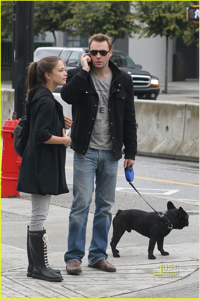 Kristin Kreuk and actor Mark Hildreth walking their dog in Vancouver, Canada, in September 2010