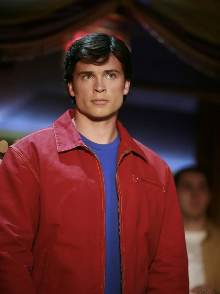 Tom Welling portraying Clark Kent wearing his signature red jacket and blue t-shirt in the television series Smallville