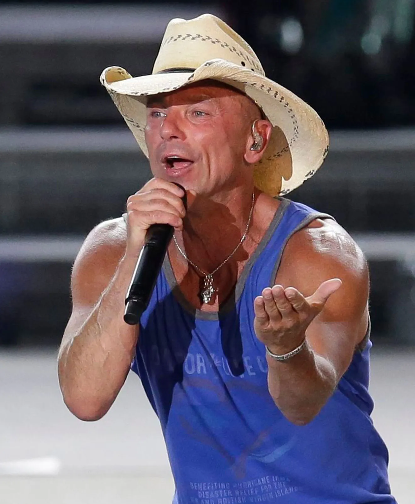 American country music singer-songwriter Kenny Chesney performing on stage