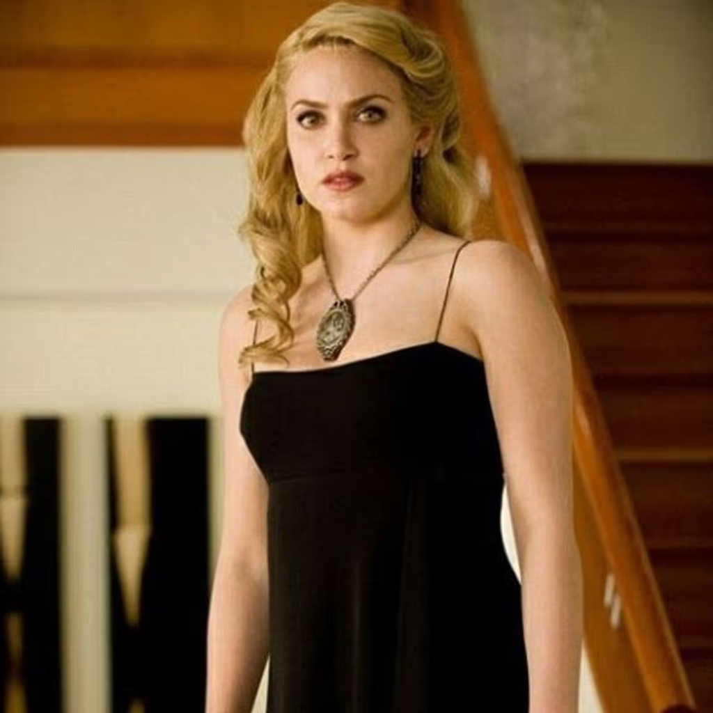 Nikki Reed portraying the character Rosalie Hale wearing a black dress and the Cullen family crest necklace in The Twilight Saga: New Moon (2009)