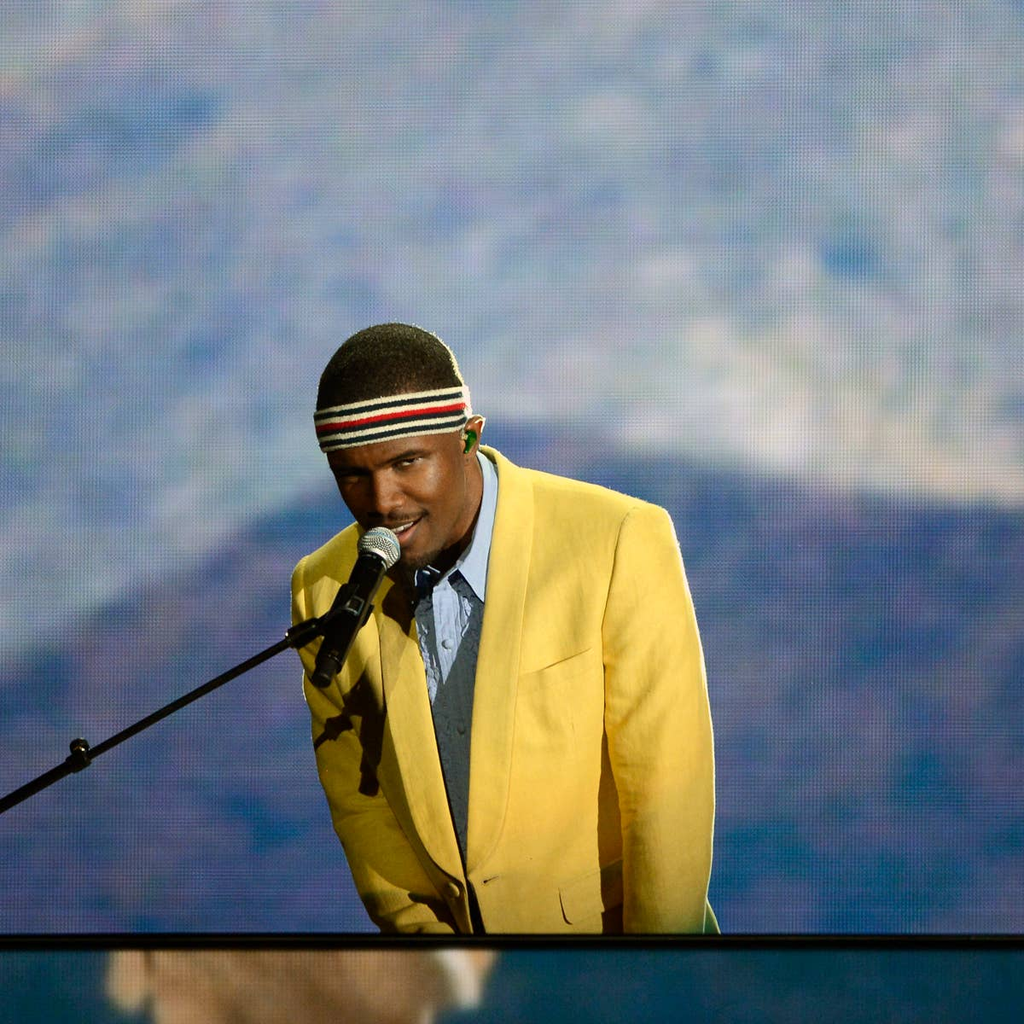 Frank Ocean wears a yellow blazer by Band of Outsiders and a striped headband during his performance of "Forrest Gump" at the 55th Annual Grammy Awards on February 10, 2013